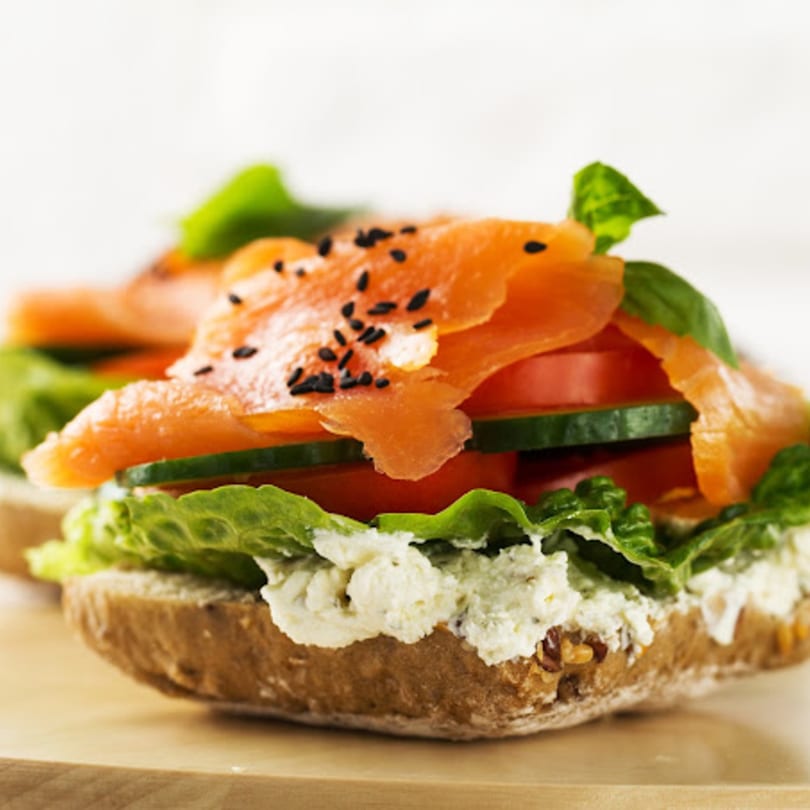 John's Famous Bagels & Deli lox bagel with cream cheese, lettuce, tomato, and cucumber.